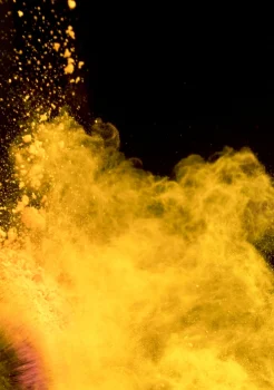 A cloud of gold dust expanding into the dark
